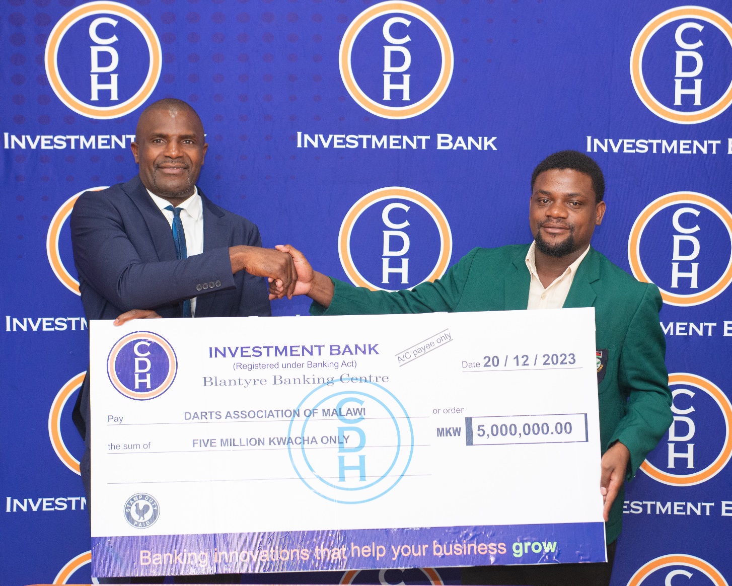 Mr Sungani Mkandawire hands over funds to Preston Mastanda Darts Association of Malawi Secretary General Mr Sungani Mkandawire hands over funds to Preston Mastanda Darts Association of Malawi Secretary General