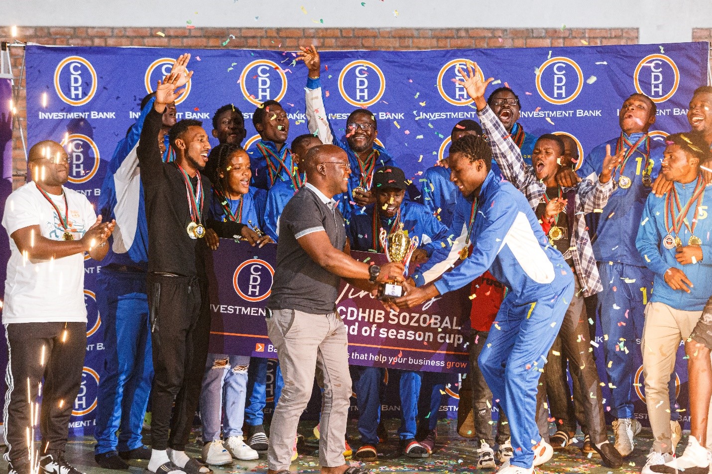 Crazy Warriors receiving the champion’s trophy for the CDHIB SOZOBAL end of season cup from CDH Investment Bank Deputy Chief Executive Officer/Executive Director, Mr Thoko Mkavea