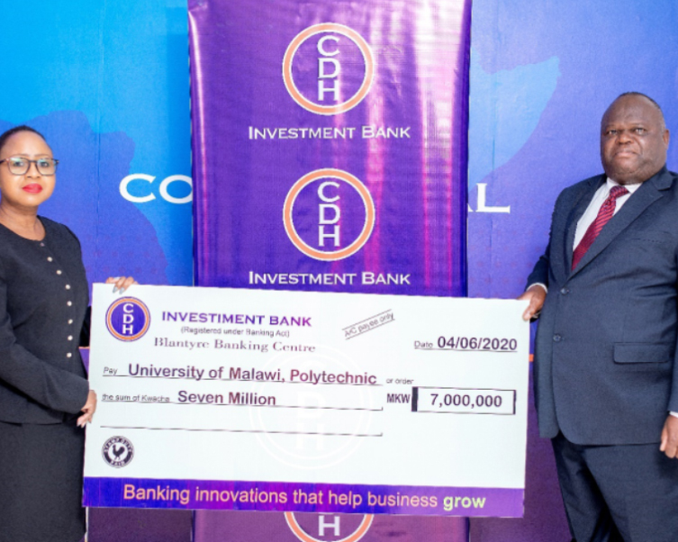 Mrs Beatrix Mosiwa-Ndovi, Chief Finance Officer of CDH Investment Bank hands over a K7 million cheque to Professor Grant Kululanga, Principal of the Polytechnic
